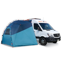 Kelty Backroads Shelter attached to the side of a Sprinter van, with sides unrolled