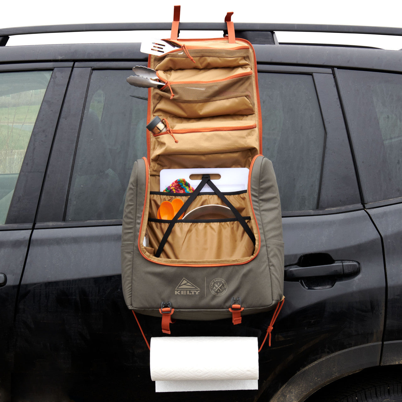 Kelty Camp Galley Deluxe hanging on the side of an SUV