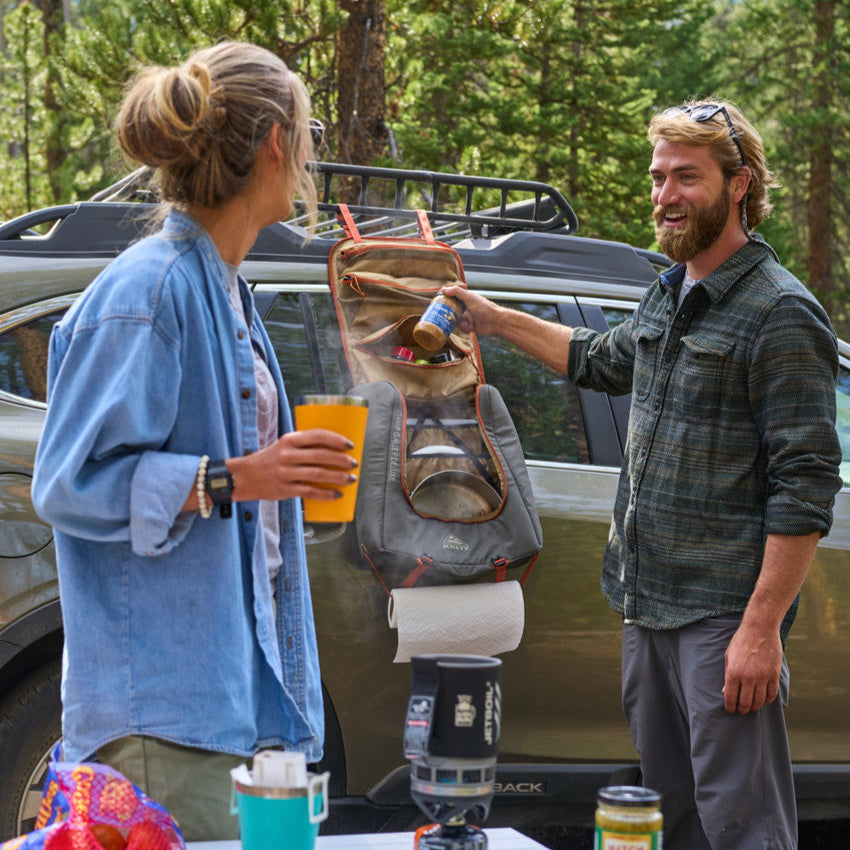 Campers with Kelty Camp Galley Deluxe  on the side of their vehicle