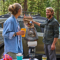 Campers with Kelty Camp Galley Deluxe  on the side of their vehicle
