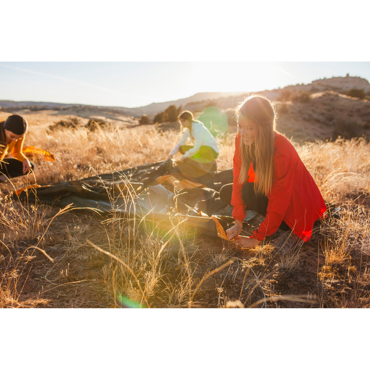 Woman very excited to set up her tent