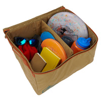Kelty Window Seat storage bin, shown open, with gear inside