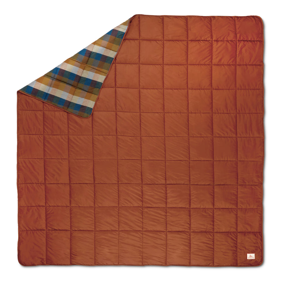 Orange Kelty Blanket with plaid corner on a white background